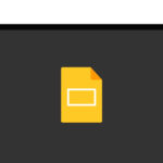 A yellow document icon displayed on a dark screen, resembling a Google Slides logo on a computer monitor.