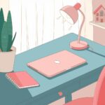 A minimalistic desk setup with a closed laptop, notebook, lamp, potted plant, and decorative house model on a teal table.