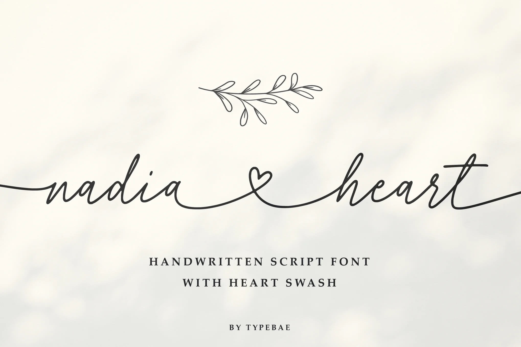 Elegant handwritten script font with heart swash, featuring decorative branch. Font titled "nadia heart" by Typebae displayed on soft, light background.