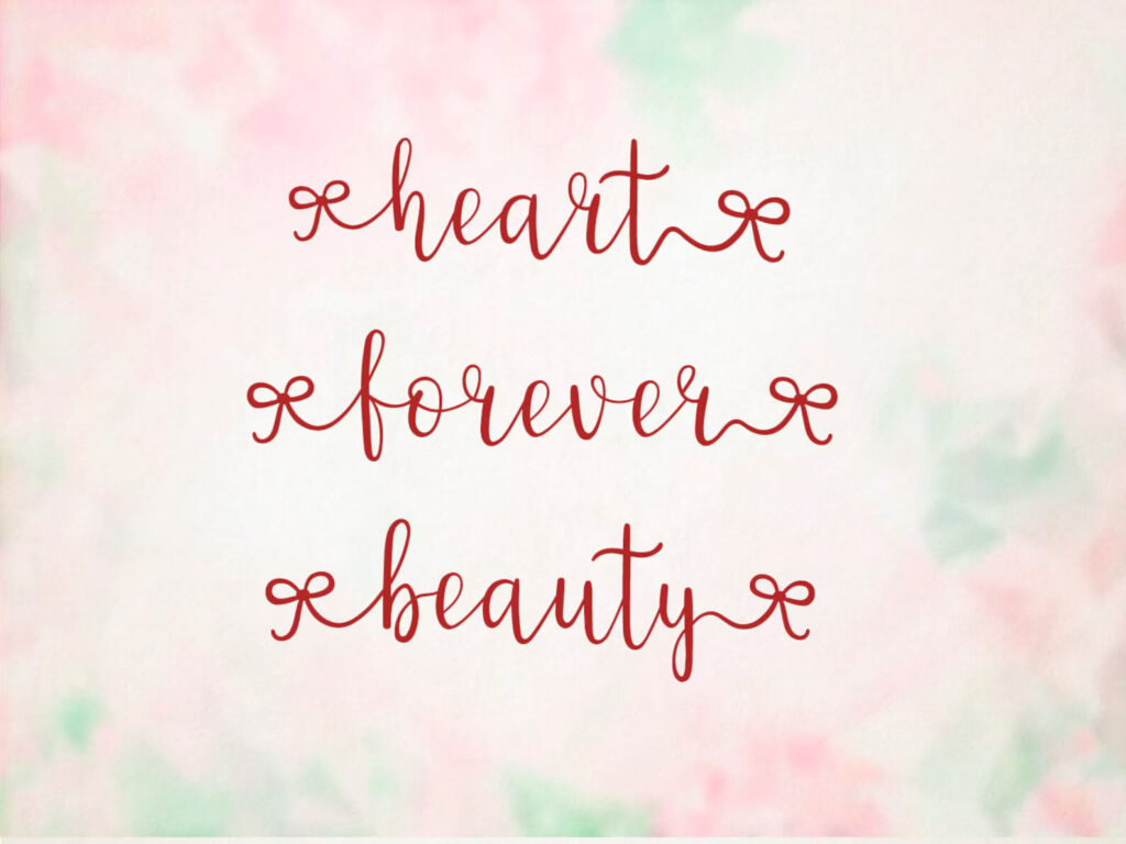 Elegant red calligraphy spells "heart," "forever," and "beauty" on a soft pink and green floral background, conveying a romantic and timeless theme.