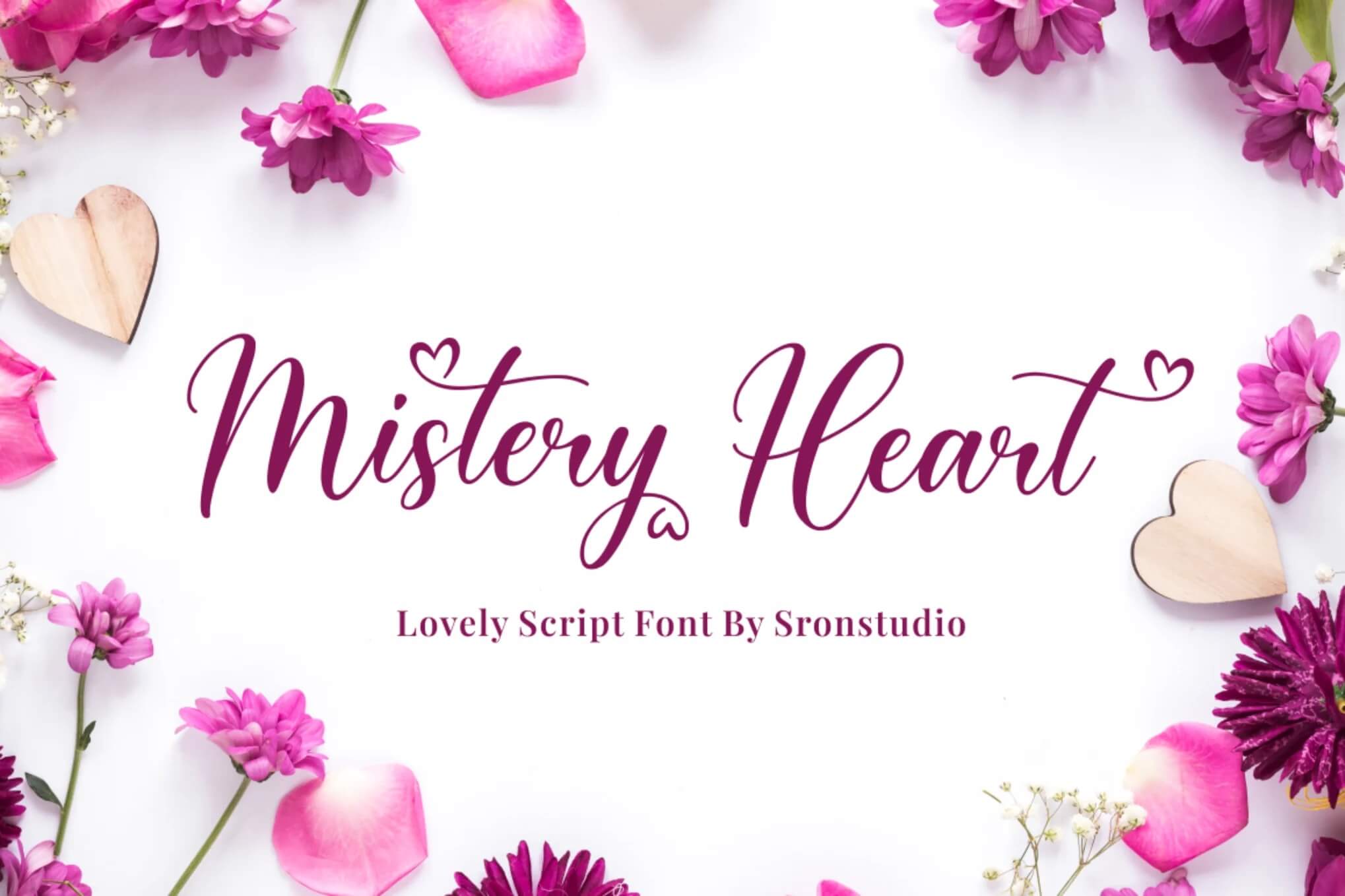 Elegant script font "Mistery Heart" surrounded by pink flowers, petals, and wooden hearts on a white background. Designed by Sronstudio.