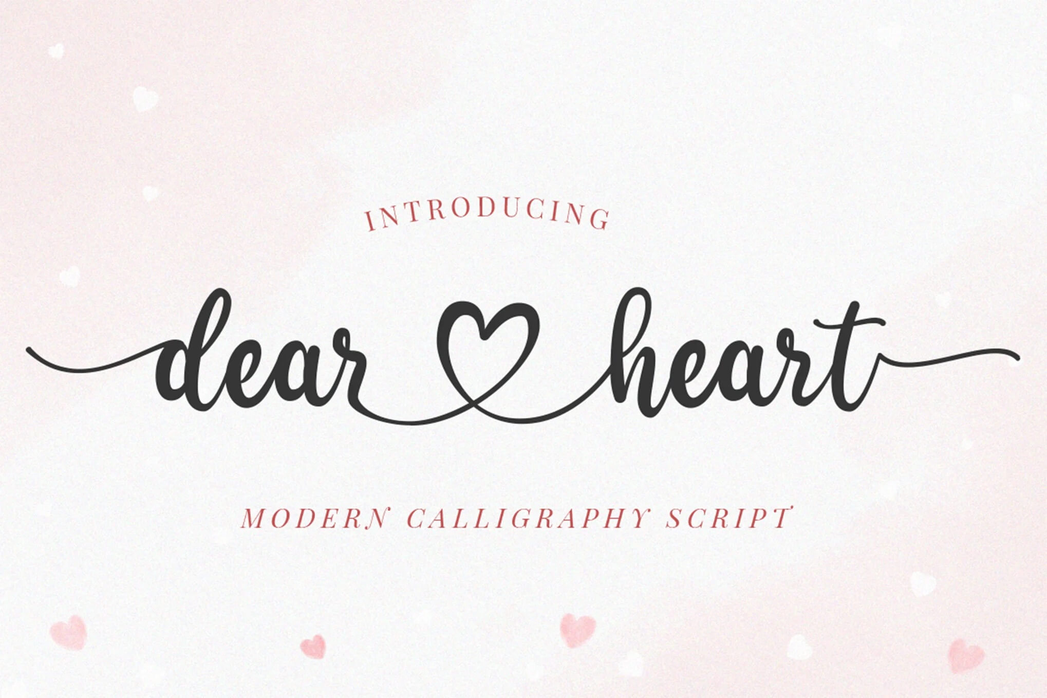 Calligraphy design reading "dear heart" with a heart symbol between words. Styled as "modern calligraphy script" on a light pink background.
