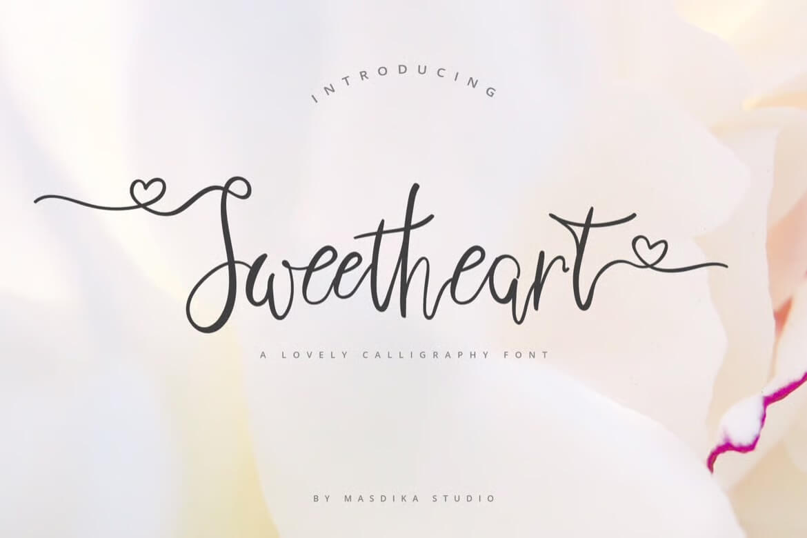 Elegant calligraphy font "Sweetheart" on a soft floral background, with decorative heart accents. Created by Masdika Studio, emphasizing romance and creativity.